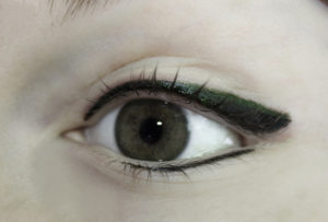 Permanent Eyeliner With moss-green shadow just above black line